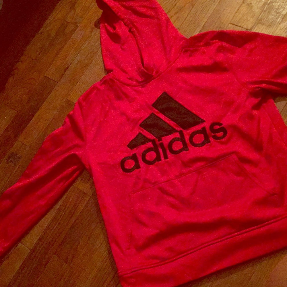 This is a red athletic adidas hoodie 😊
